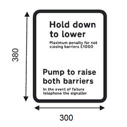 Sign showing wording reading: Hold down to lower (maximum penalty for not closing barriers £1000). “Pump to raise both barriers” (in the event of failure phone signaller)
